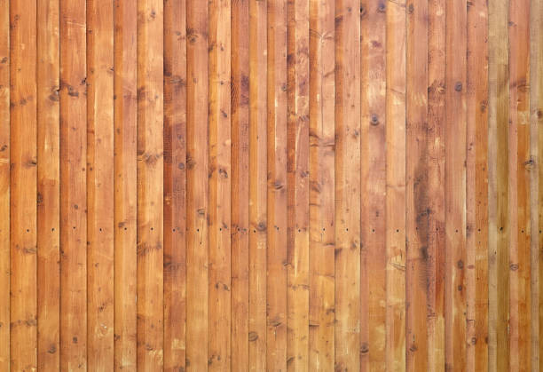 Wooden wall assembled of boards This is an old wooden wall assembled of boards. gnarly wood texture stock pictures, royalty-free photos & images