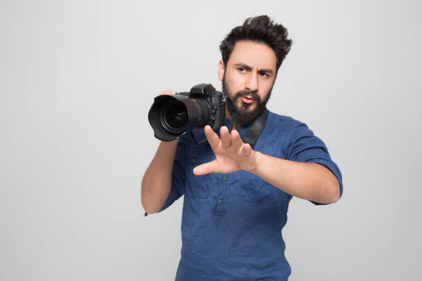 istock young male photographer posing in studio 1161256975