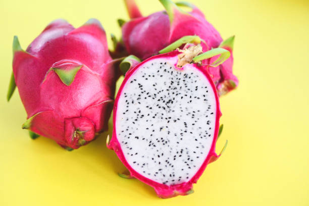 istock Dragon fruit slice on yellow background / Fresh pitaya summer tropical fruit 1161261163