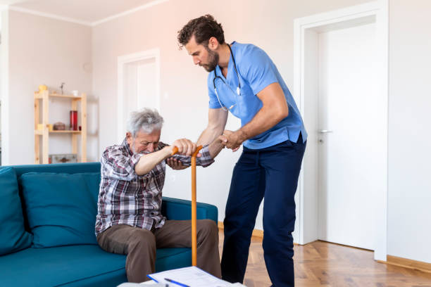 istock Caregiver Helping Senior Man 1161266919