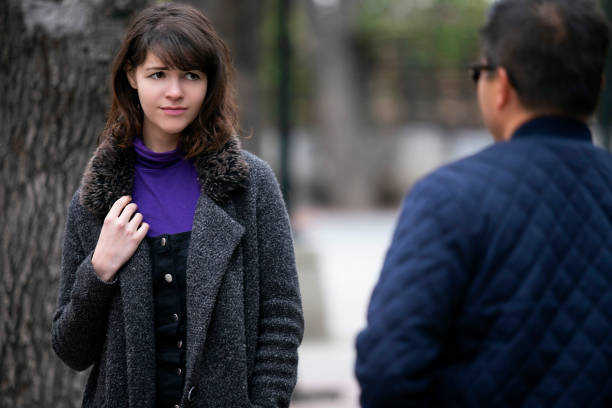 Woman Running Into an Ex Boyfriend or Insulted By Stranger Woman walking outdoors in the city and looking snobby while running into an ex boyfriend or looking annoyed by an insulting stranger.  It also depicts social anxiety. ex girlfriend stock pictures, royalty-free photos & images