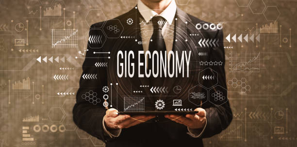 Gig economy with businessman holding a tablet computer stock photo