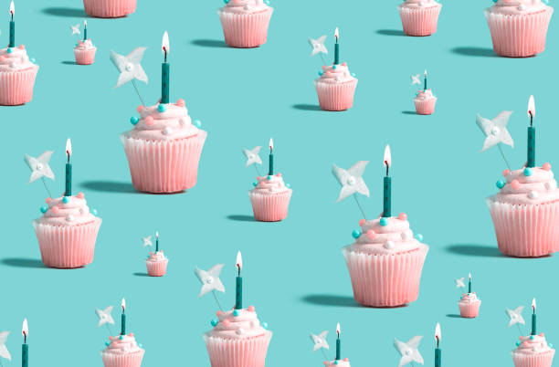 istock Big and small cupcakes with lit candles 1161275378