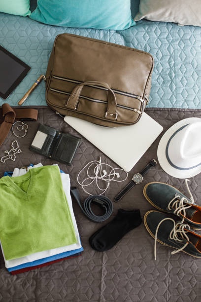 istock Man's travel accessories on bed, flat lay 1161275398