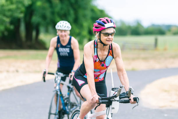 istock Two senior triathletes prepare to go cycling together 1161275920