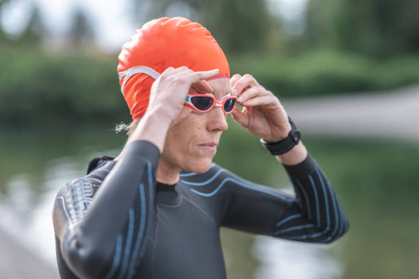 istock A middle-aged female triathlete prepares for the swim stage 1161275945