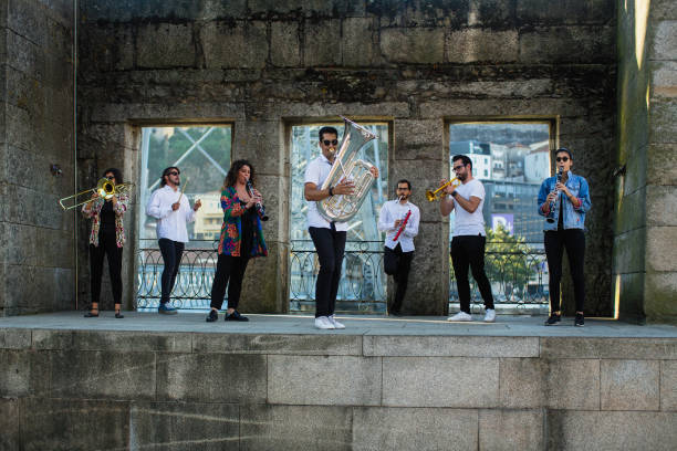 istock Group of musicians with wind instruments playing on the street. 1161276013