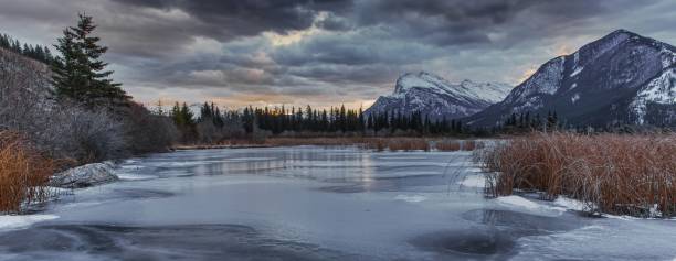 istock Scenic view of mountains forest and river 1161282366