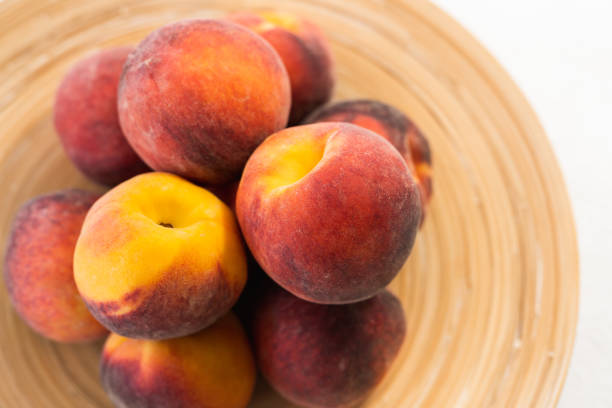 istock Fresh Ripe Peaches on a Plate, View from Above 1161283675