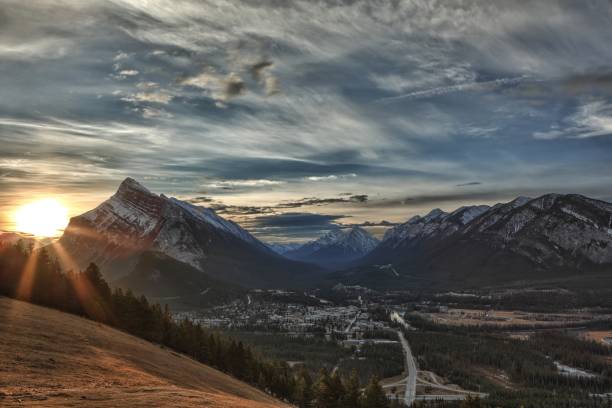 istock Sunrise over snowcapped mountains and town in winter 1161283770