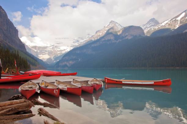 istock Canoes lake mountains 1161283955