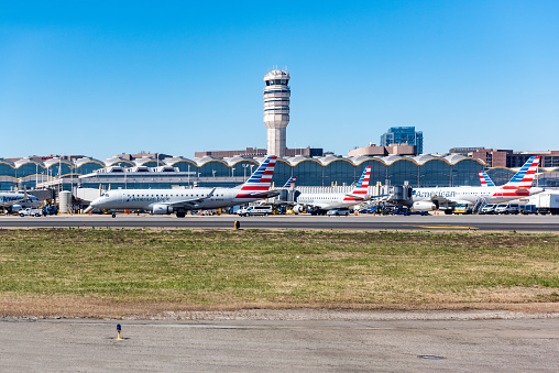 Washington, DC, United States - March 26, 2019: Ronald Reagan Washington National Airport view,  The airplanes of American Airlines are waiting for travelers on the Ronald Reagan Washington National Airport in Washington DC, USA.