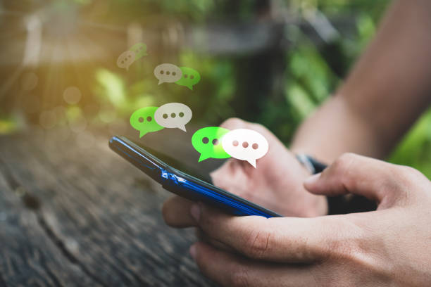 istock Woman hand using smartphone with chat icon background. Business communication social network concept. 1161296081