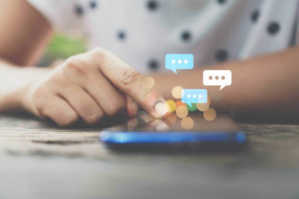 istock Woman hand using smartphone with chat icon background. Business communication social network concept. 1161296609