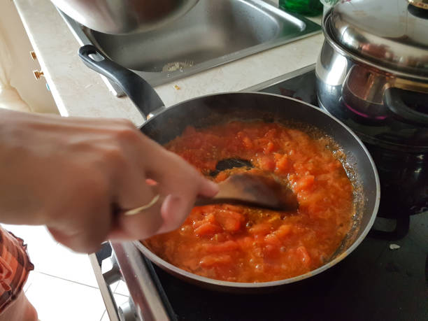 istock frying pan cooking tomato sauce for omelette of eggs and cheese 1161300267