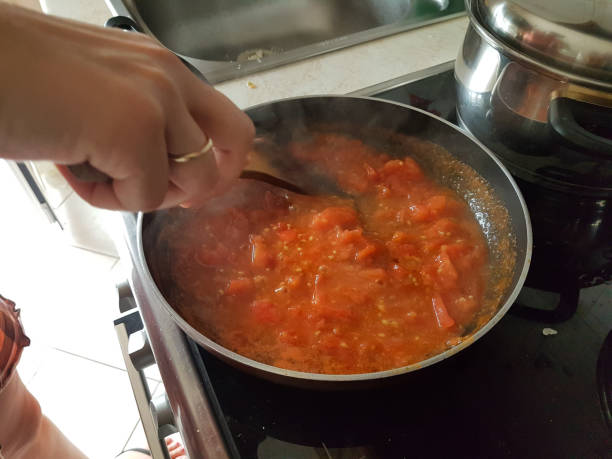 istock frying pan cooking tomato sauce for omelette of eggs and cheese 1161300293