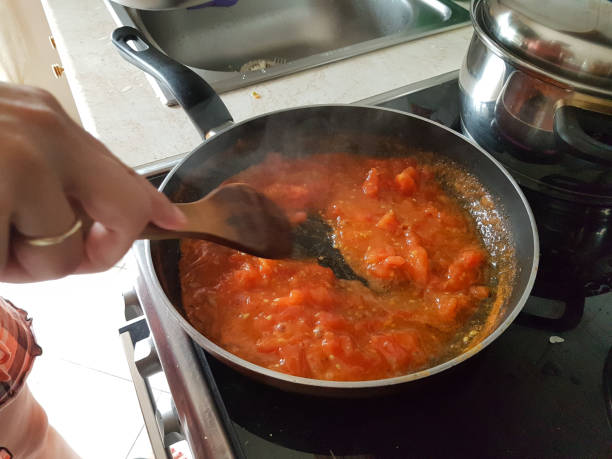 istock frying pan cooking tomato sauce for omelette of eggs and cheese 1161300294