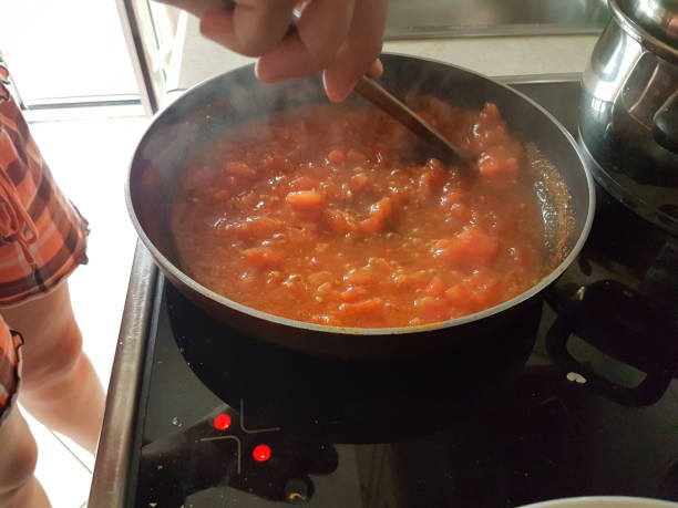 istock frying pan cooking tomato sauce for omelette of eggs and cheese 1161300481