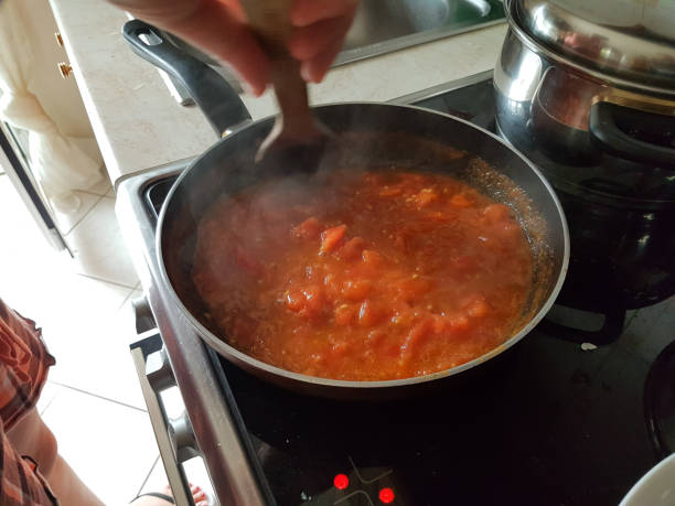 istock frying pan cooking tomato sauce for omelette of eggs and cheese 1161300533