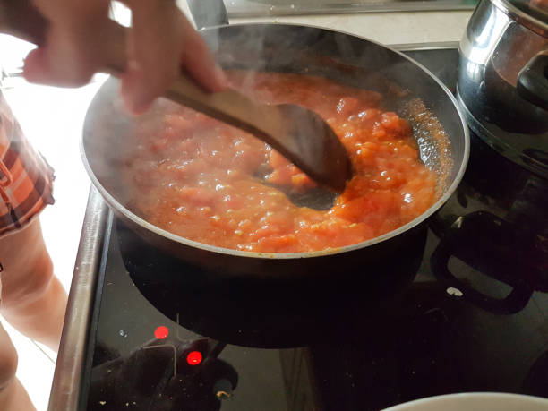 istock frying pan cooking tomato sauce for omelette of eggs and cheese 1161300565