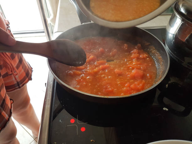 istock frying pan cooking tomato sauce for omelette of eggs and cheese 1161300758