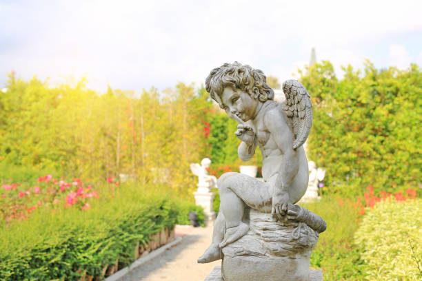 istock Cupid sculpture in summer garden outdoor. 1161302782