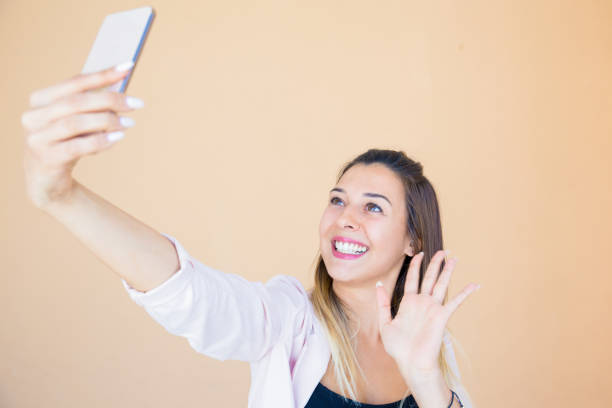 istock Happy joyful lady posing for selfie 1161303755