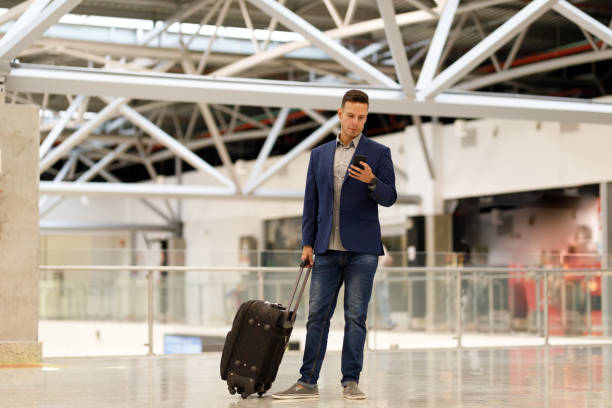 istock Businessman walking at the airport 1161303897