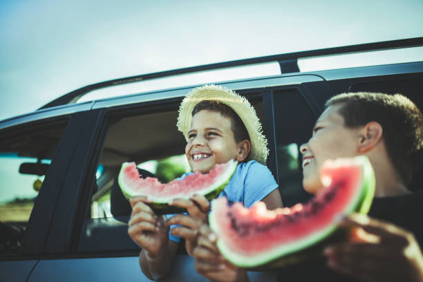 istock Kids Eating Watermelon Outdoors 1161304770