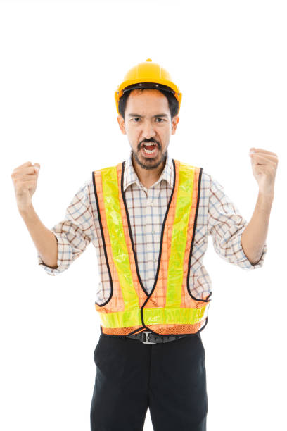 istock Engineer man cross arm orange helmet and vest 1161305057