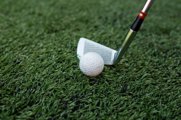 istock Golf stick and ball on green grass 1161305133