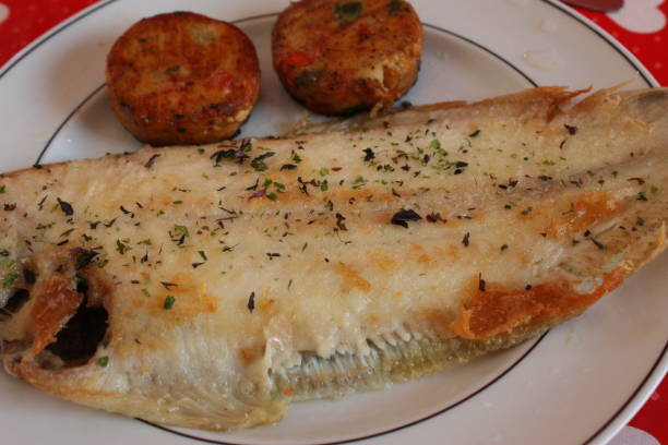 istock Sole fried fish fry with dry seaweed served with vegetable donuts 1161306127