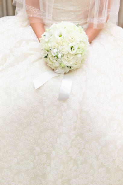Bride holding flower bouquet