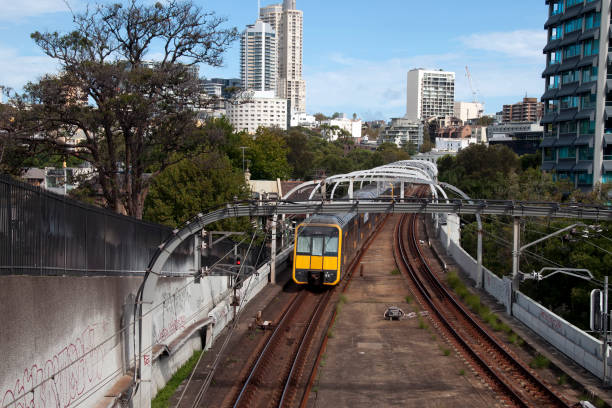 Electric train moving away along suburban train track