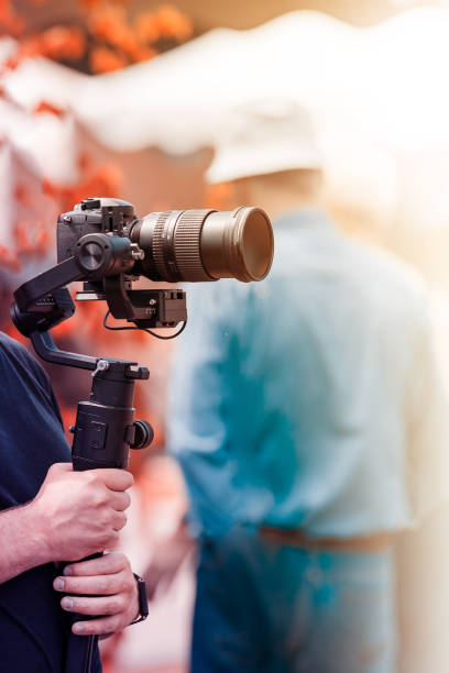 istock Video shooting with a camera with a tripod with a black stabilizer 1161314638