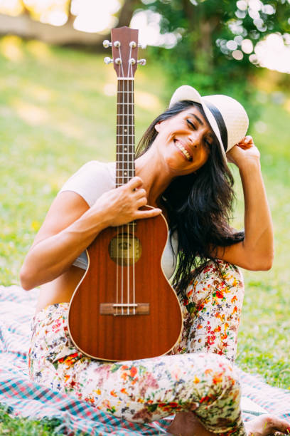 istock Young Happy Woman With Guitar 1161315588