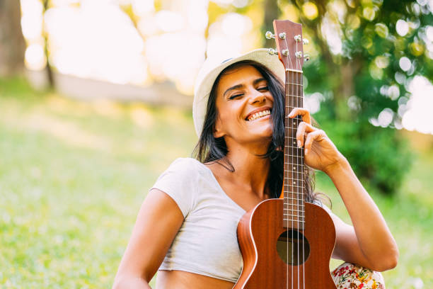 istock Young Happy Woman With Guitar 1161315604