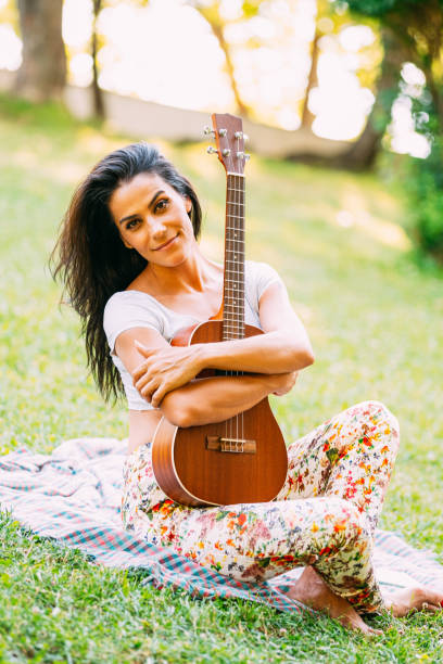 istock Young Happy Woman With Guitar 1161316747