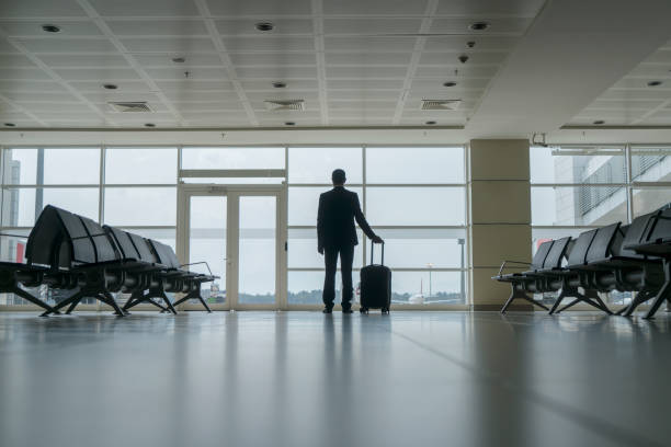 istock Businessman in airport 1161317503