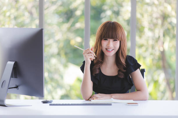 istock Young lady in black dress 1161317739