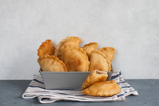 Homemade panzerotti - southern italian fried turnover. With mozzarella and mortadella filling.