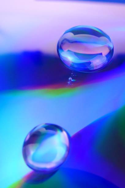 istock Drop macro background.Water drop on a deep blue iridescent background with gradation and highlights. Abstract blob texture .Phone wallpaper 1161319951
