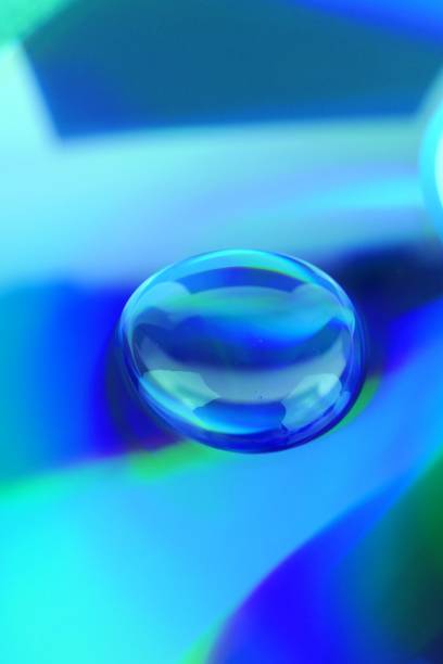 istock Drop background.Water drop on a deep blue iridescent background with gradation and highlights. Abstract blob texture background.Phone wallpaper 1161319954