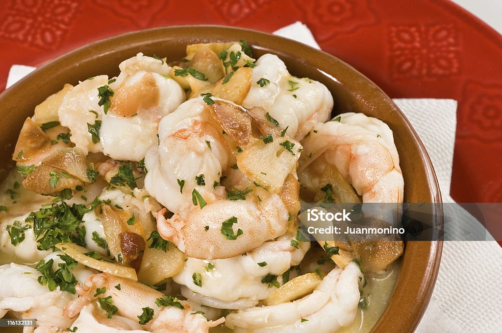 Garlic Shrimp Scampi (gambas al ajillo) shrimps cooked in olive oil, butter and garlic sauce Casserole Stock Photo