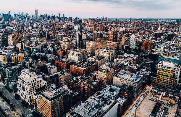 istock Aerial view from helicopter sightseeing tour around Manhattan downtown district. Scenery bird's eye view with blocks of buildings leaving horizon. Metropolis with developed city urban infrastructure 1161321348