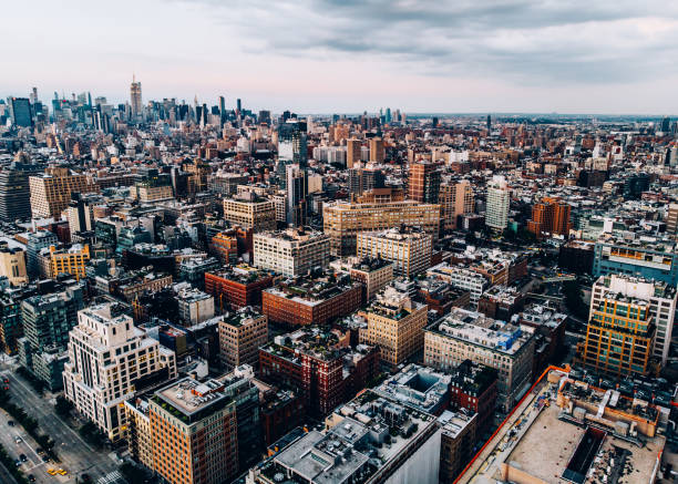 istock Aerial view from helicopter sightseeing tour around Manhattan downtown district. Scenery bird's eye view with blocks of buildings leaving horizon. Metropolis with developed city urban infrastructure 1161321352