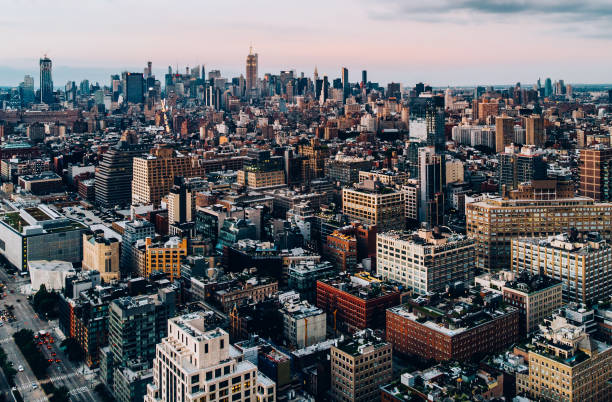 istock Aerial view from helicopter sightseeing tour around Manhattan downtown district. Scenery bird's eye view with blocks of buildings leaving horizon. Metropolis with developed city urban infrastructure 1161321377