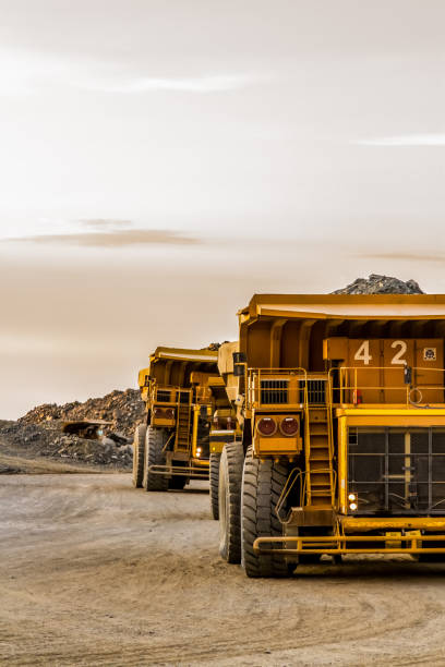 Dump Trucks transporting Platinum ore for processing Platinum and Palladium Mining and processing, Dump Truck for transporting rocks mining equipment stock pictures, royalty-free photos & images