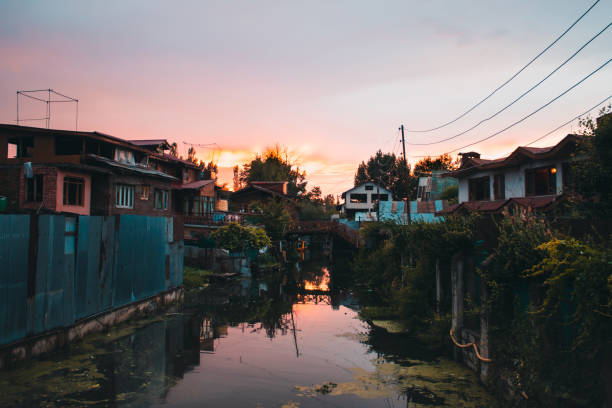 istock Sunset over Dal lake with Houses on both it's sides. 1161322549