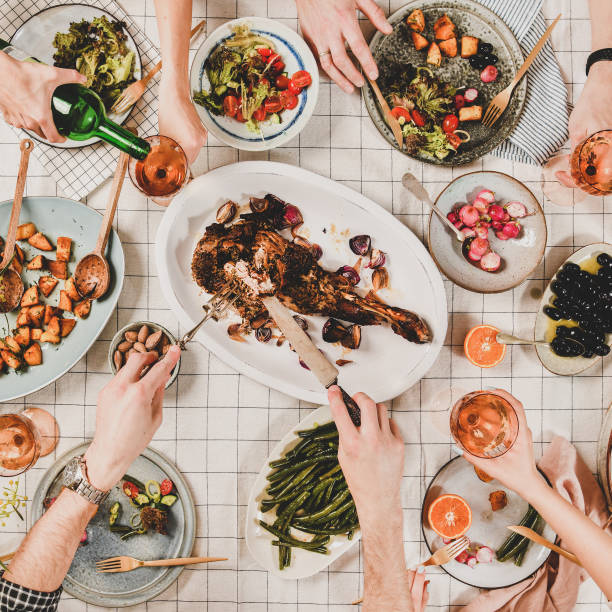 istock Flat-lay of people eating and drinking rose wine, square crop 1161324569